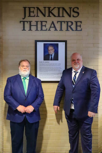 Rolfe Jenkin's brother Dennis Jenkins (left) and LMC President Dr. Trevor Kubatzke unveiled the new name of the Lake Michigan College Mendel Center Jenkins Theatre